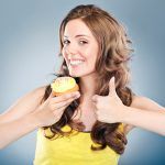 happy-woman-with-cupcake-horiz